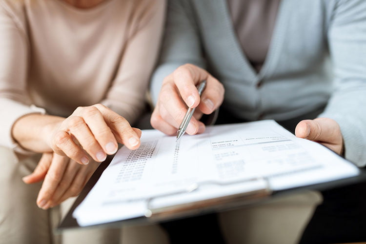 Couple reviewing assets
